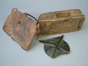 Appraisal: A North African bronze buckle an iron wool comb and