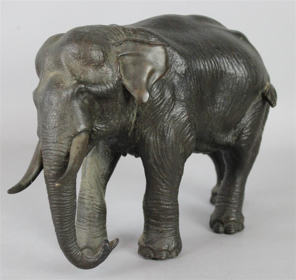 Appraisal: JAPANESE BRONZE MODEL OF A STRIDING ELEPHANT molded six-character maker's