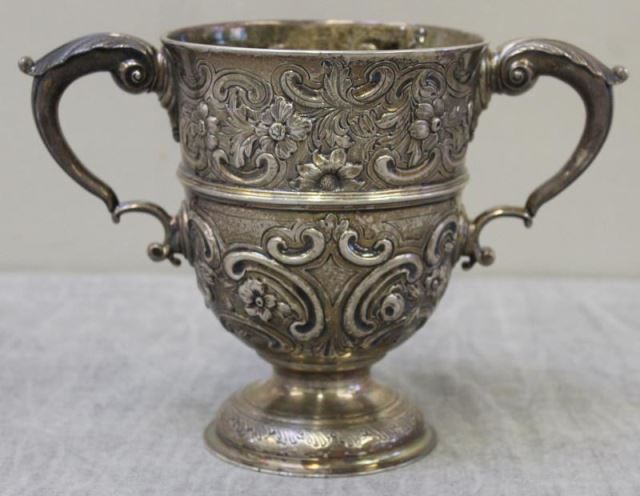 Appraisal: STERLING Antique Irish Repousse Loving Cup Two handled cup with