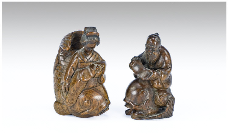 Appraisal: Pair of Well Carved Hardwood Netsukes Carved as a Wise