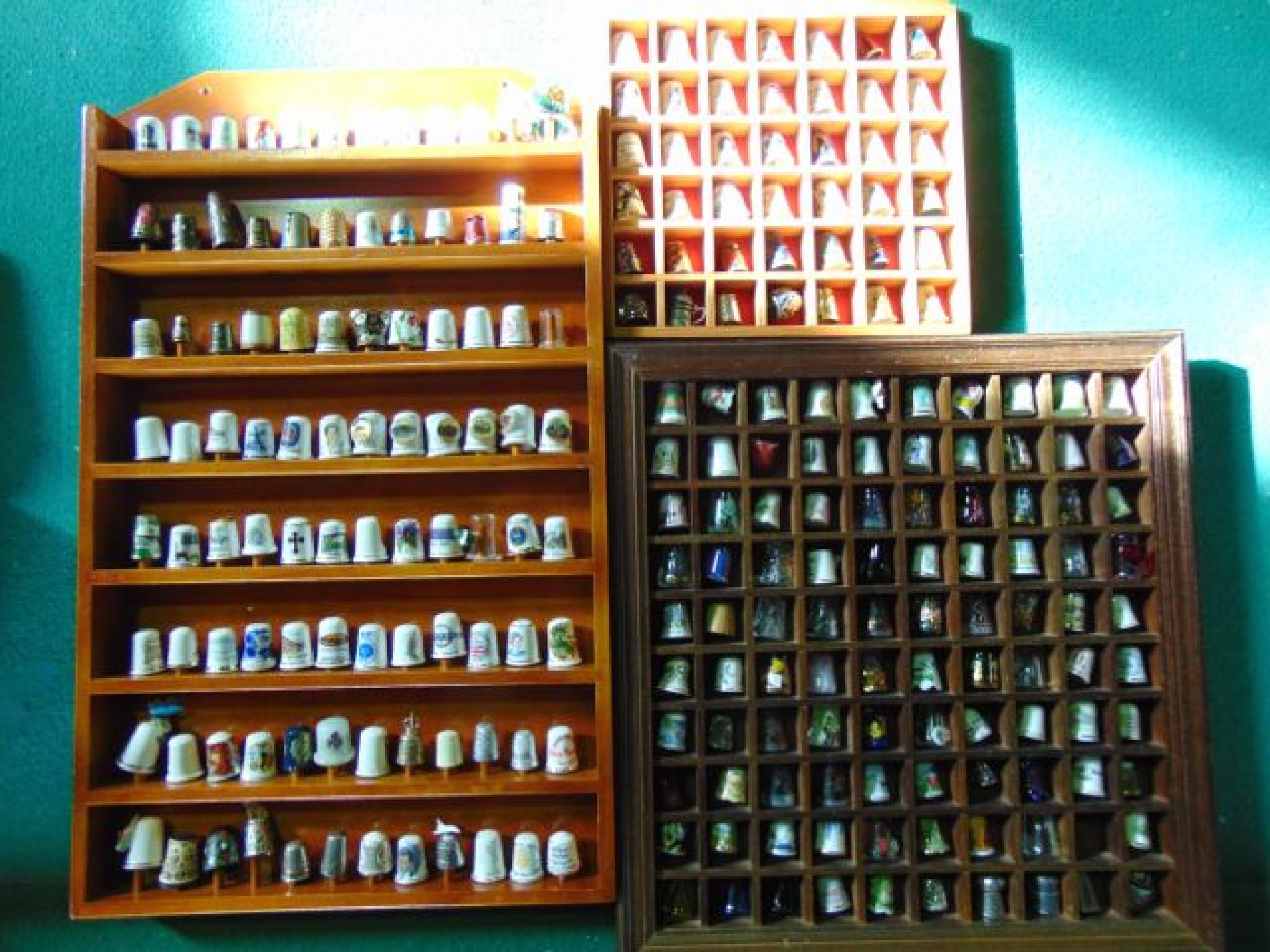 Appraisal: Three display racks containing an extensive collection of ceramic glass