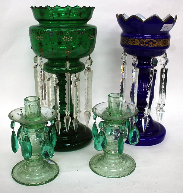 Appraisal: A VICTORIAN GREEN GLASS TABLE LUSTRE with foliate decoration in