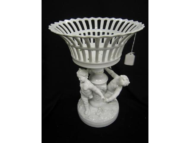 Appraisal: Fine Porcelain Centerpiece with Three Putti dancing basket top tall