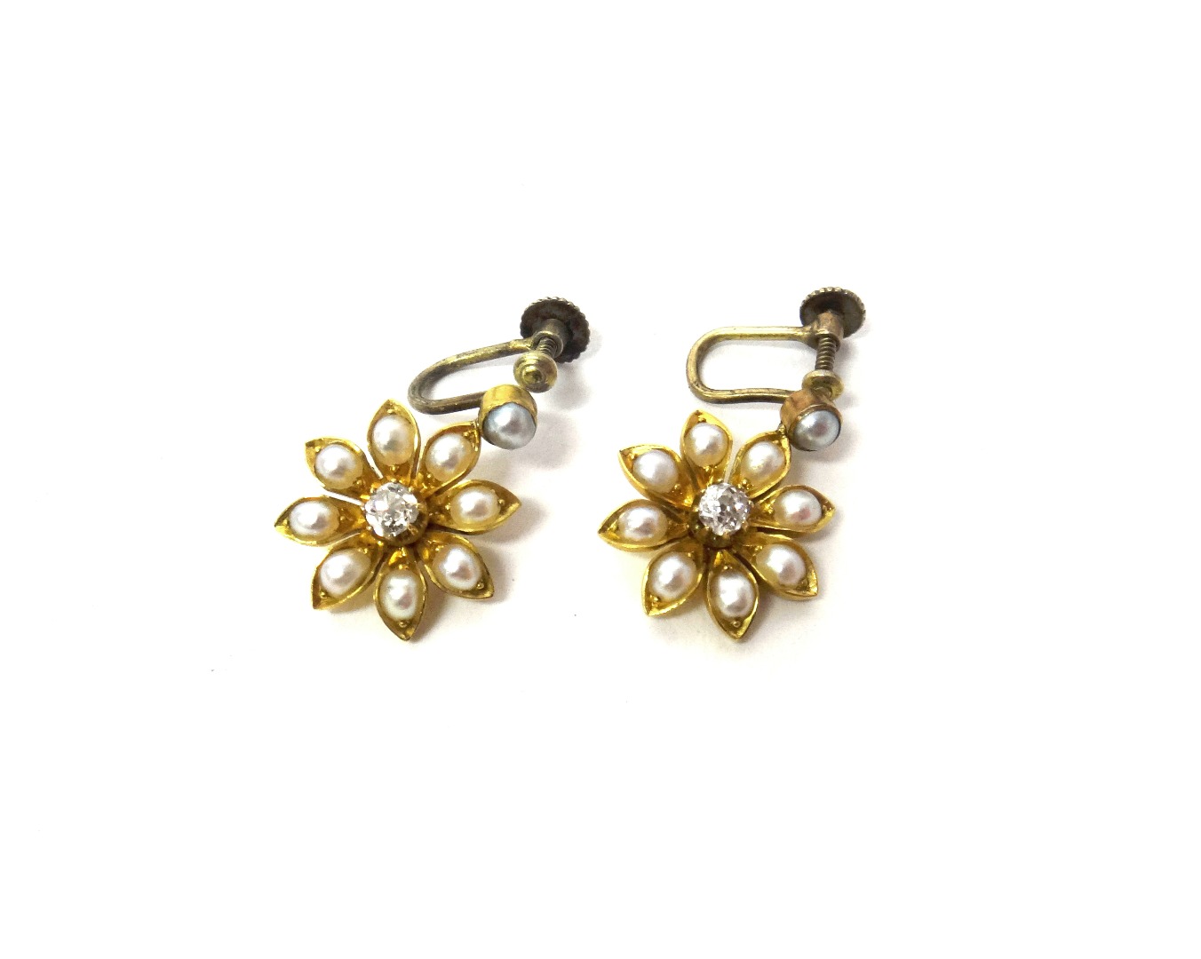 Appraisal: A pair of gold diamond and half pearl set earrings