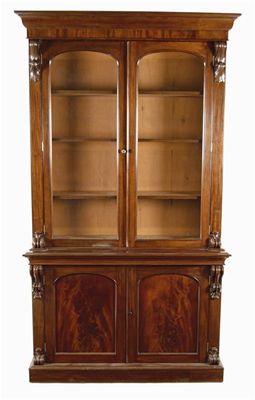 Appraisal: A Victorian mahogany library bookcase with applied scroll volutes with