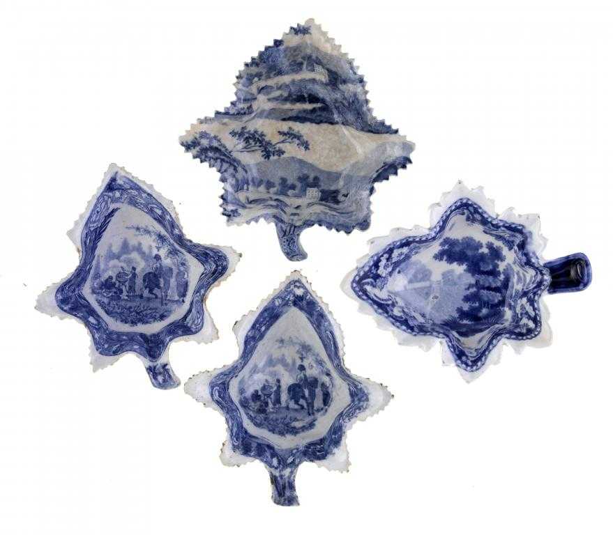 Appraisal: FOUR BLUE PRINTED EARTHENWARE AND PEARLWARE PICKLE DISHES of vine