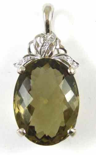 Appraisal: LEMON CITRINE AND WHITE GOLD PENDANT The large oval checkerboard-cut