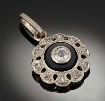 Appraisal: A Platinum Gold Diamond and Onyx Pendant Platinum and k