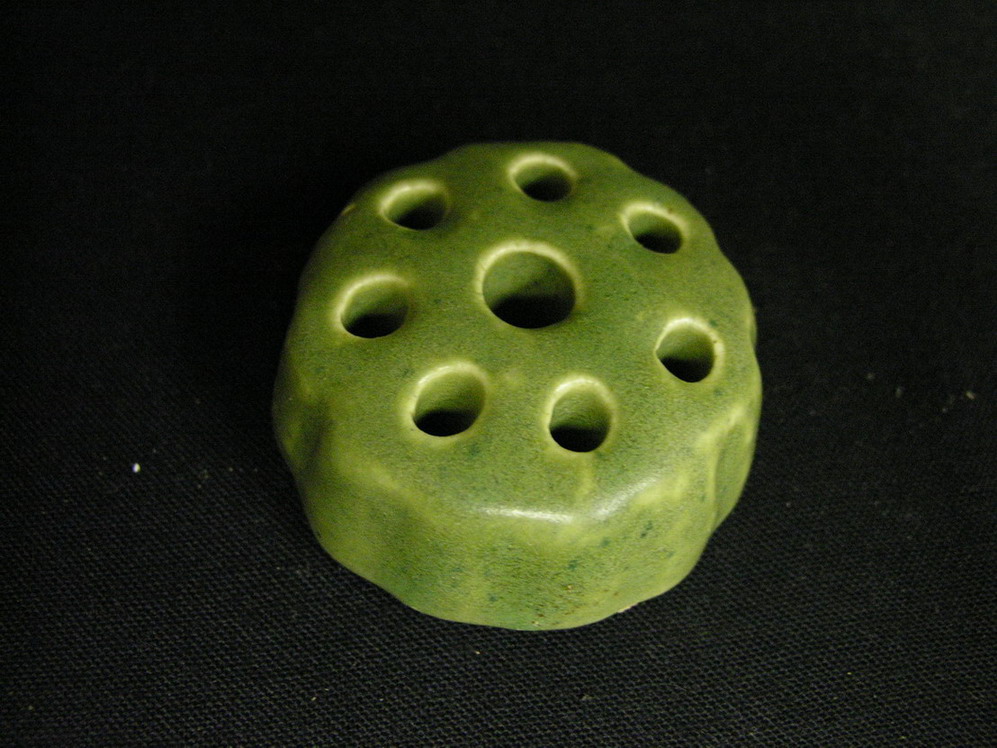 Appraisal: GREEN POTTER FLOWER FROG Size diameter