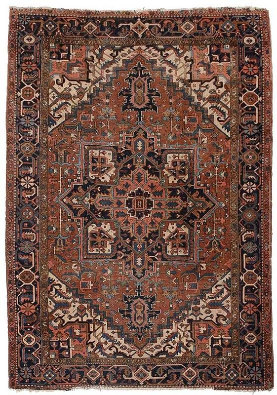 Appraisal: Heriz Carpet early th century rust colored field ivory spandrels