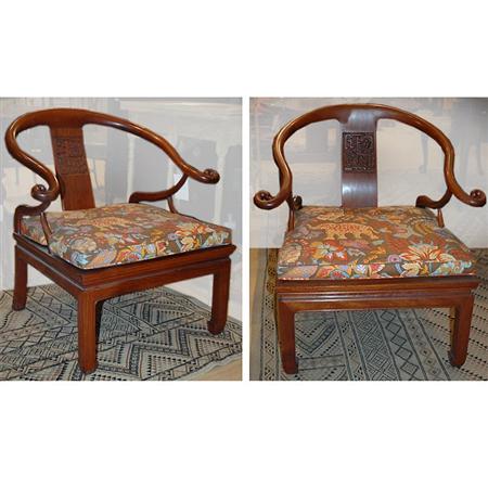 Appraisal: Pair of Chinese Hardwood Yoke Back Armchairs Estimate -