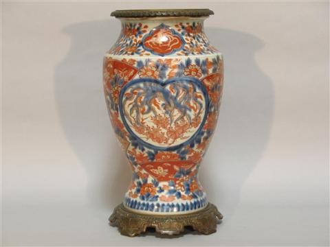 Appraisal: GILT-BRONZE-MOUNTED JAPANESE IMARI BALUSTER VASE Meiji period the vase of