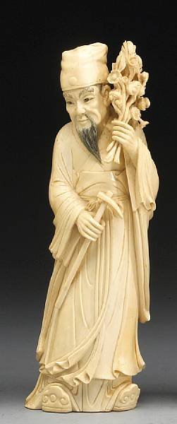 Appraisal: A carved ivory figure of a sage Shown dressed in