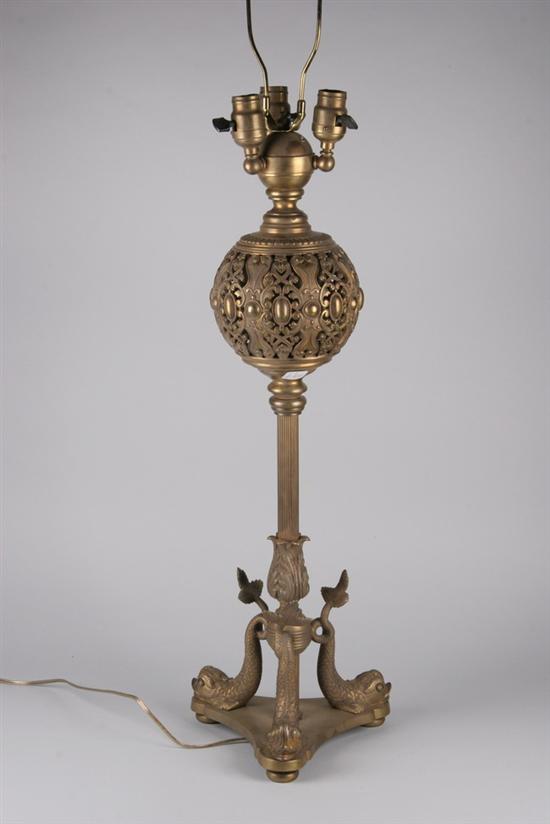 Appraisal: GILT-METAL THREE-LIGHT TABLE LAMP early th century Dolphin base pierced