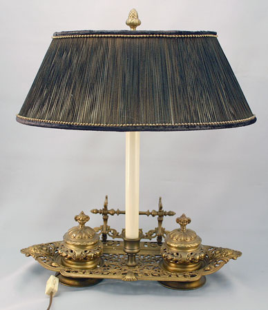 Appraisal: DOUBLE INKWELL STAND CONVERTED TO DECORATIVE LAMP Cherub finials on