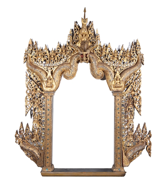 Appraisal: South-east Asian gilded arch frame with openwork detail mounted figures