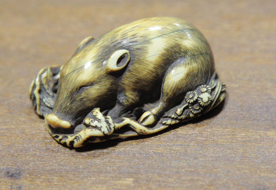 Appraisal: NETSUKE Japan th century A carved ivory netsuke of a