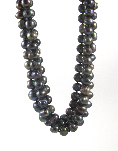 Appraisal: MULTI-STRAND BLACK PEARL NECKLACE with four twisted strands of baroque