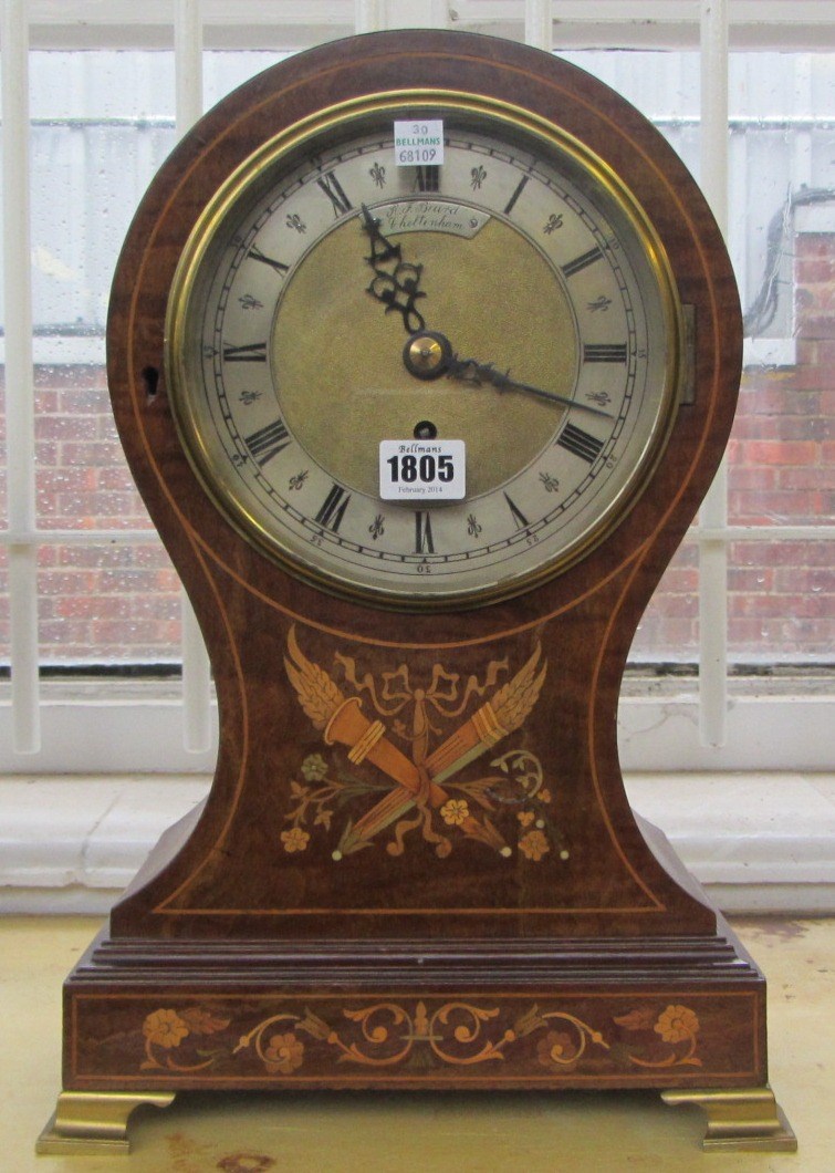 Appraisal: An Edwardian mahogany and parquetry inlaid balloon shaped mantel clock