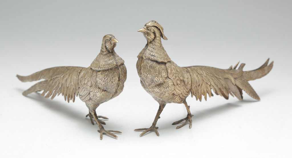 Appraisal: Twentieth century Cast white metal male and female pheasants Unmarked