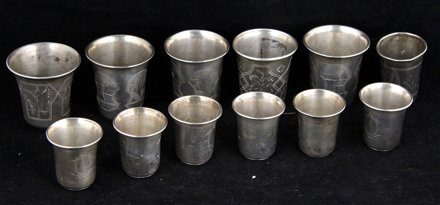 Appraisal: Twelve Russian white metal tot measures various makers th Century