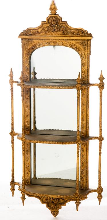 Appraisal: th CENTURY GILTWOOD AND COMPOSITION MIRROR-BACKED HANGING ETAGERE the crest