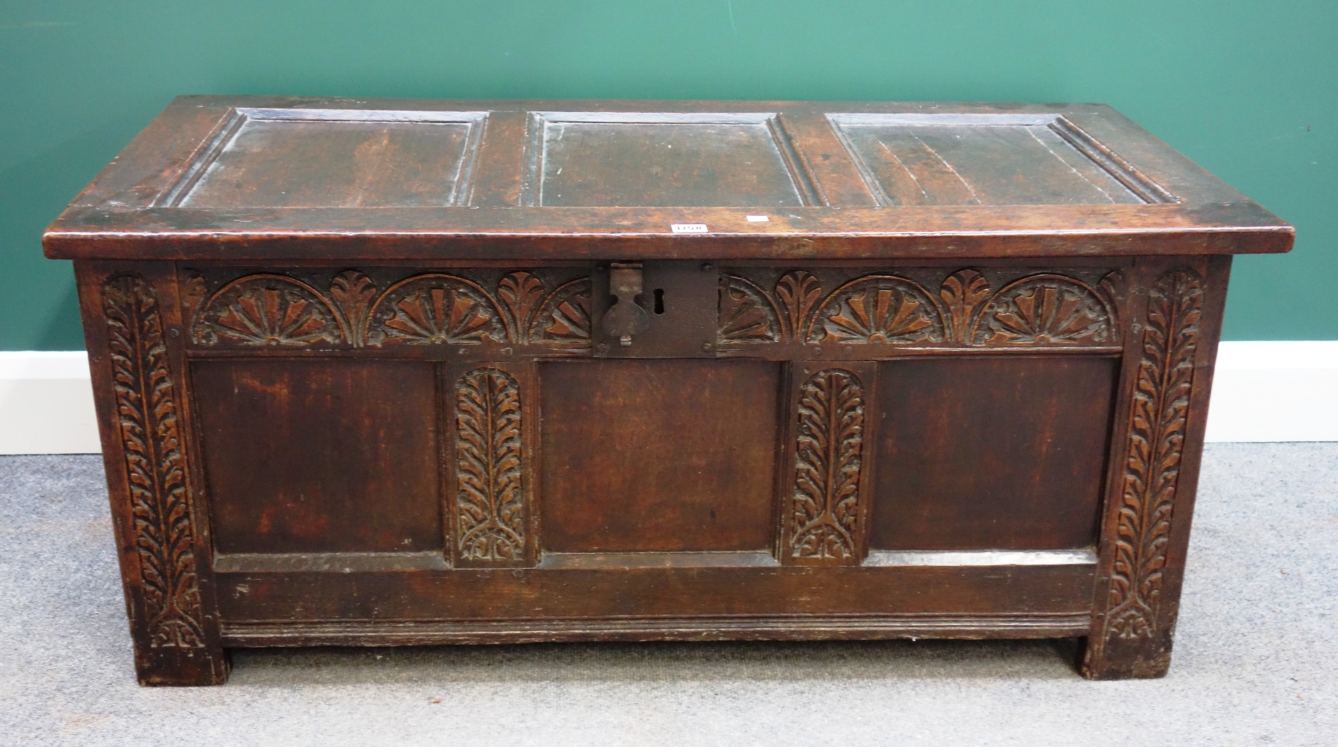 Appraisal: A th century oak coffer with triple panel lid and