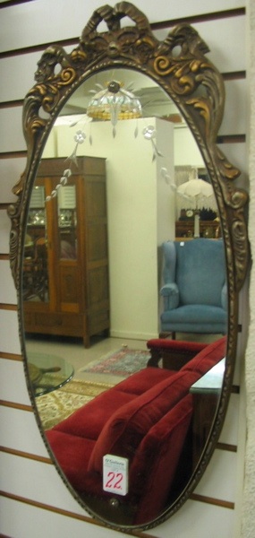 Appraisal: AN AMERICAN OVOID WALL MIRROR c 's having a carved