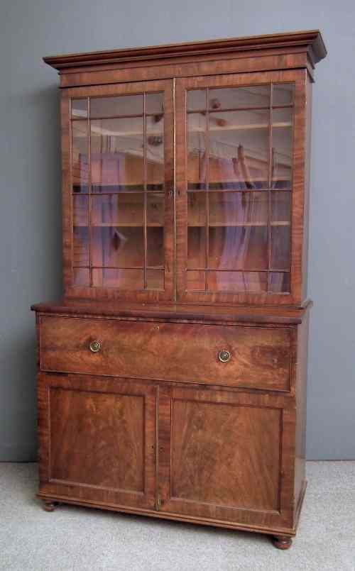 Appraisal: A William IV figured mahogany Secretaire bookcase the upper part