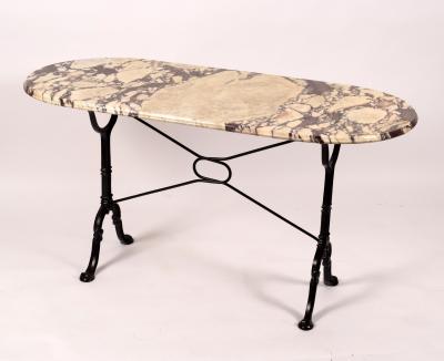 Appraisal: A marble top table on cast iron end supports cm