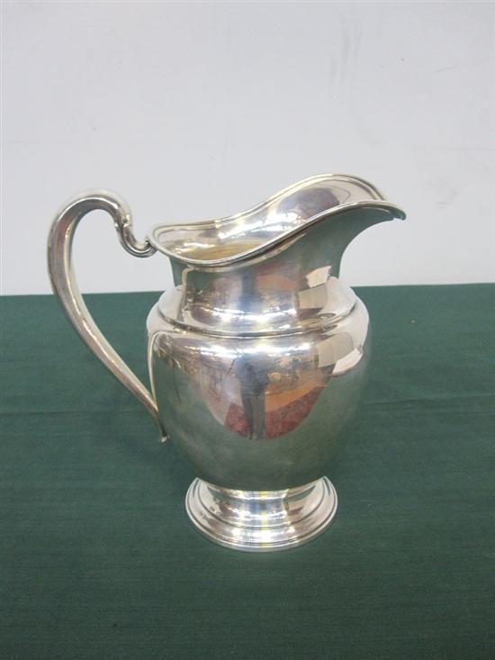 Appraisal: STERLING SILVER WATER PITCHER Georgian style with reeded rim by