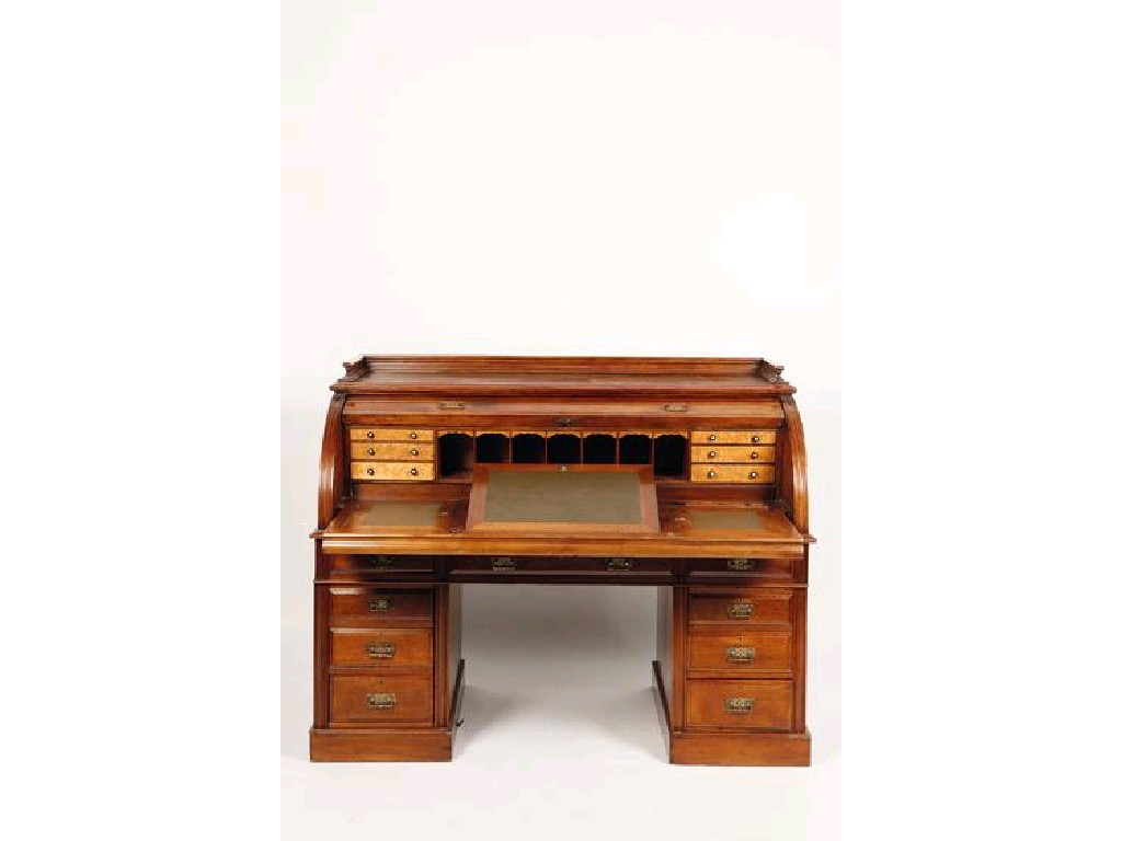 Appraisal: A LATE VICTORIAN WALNUT CYLINDER FRONTED WRITING DESK the shaped