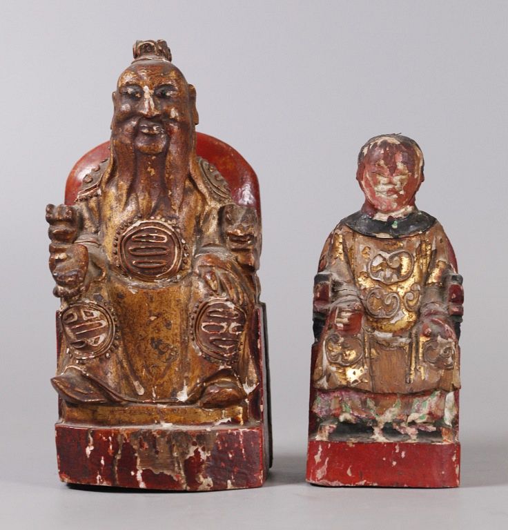 Appraisal: Chinese wooden figural carvings possibly th c larger in H