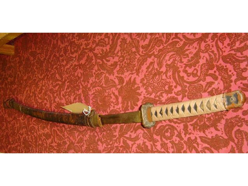 Appraisal: A Japanese officers sword a scabbard bound with bamboo the