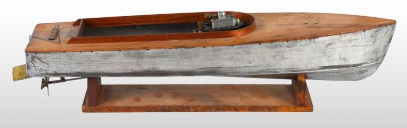 Appraisal: Tin Wood Boucher Live Steam Boat Toy Description Plate on