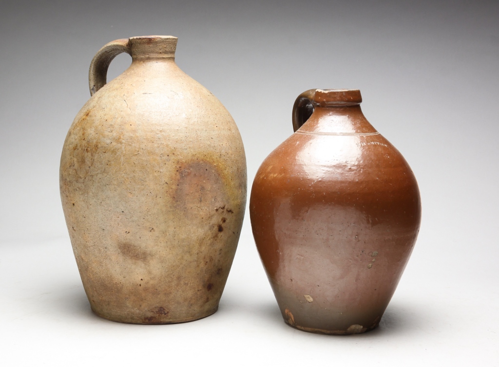 Appraisal: TWO AMERICAN STONEWARE JUGS Mid th century Ovoid with applied