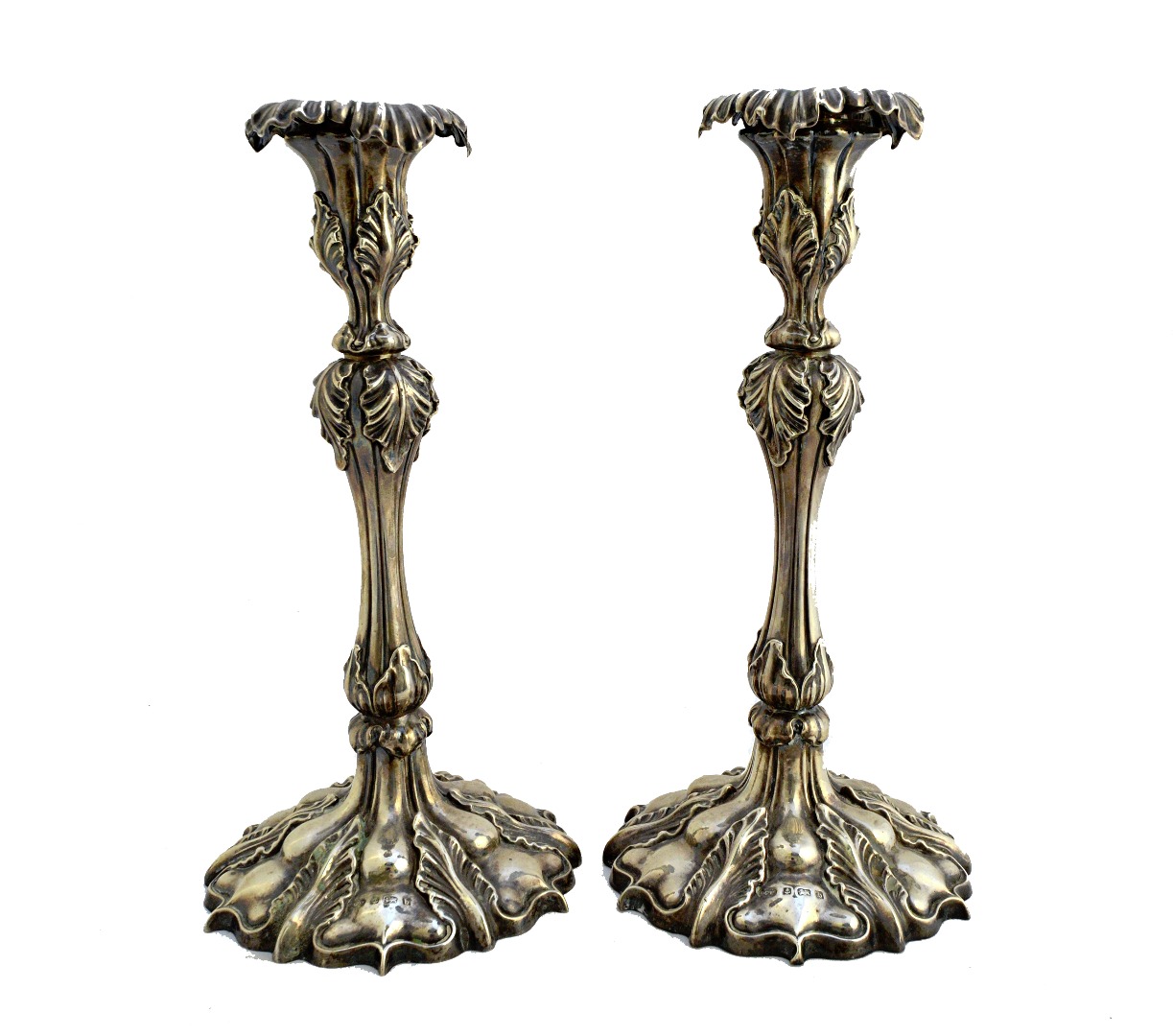 Appraisal: A pair of silver table candlesticks each with a tapered