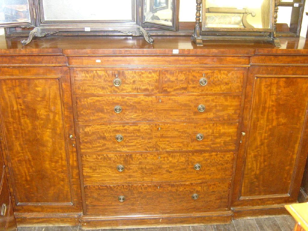 Appraisal: A substantial Victorian mahogany breakfront side cupboard fitted with an