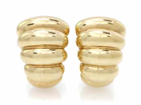 Appraisal: A Pair of Yellow Gold Ribbed Earclips Stamp Italy dwts