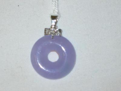 Appraisal: AN ART DECO STYLE LAVENDER JADE PENDANT of circular form