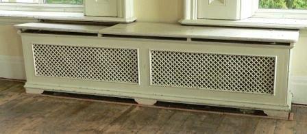 Appraisal: A double pierced cast radiator surround with pierced returns and