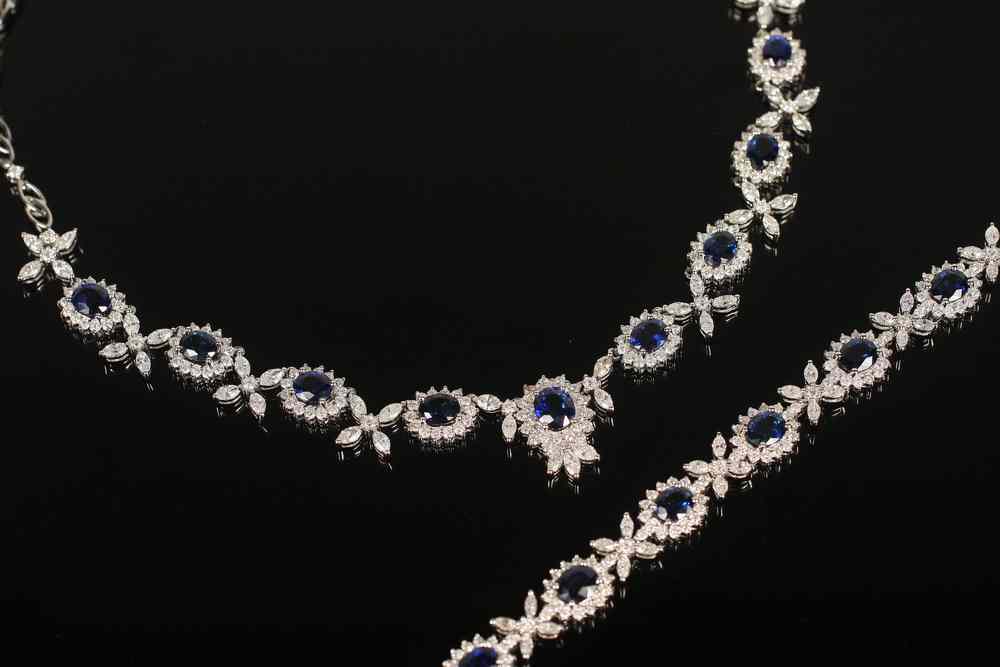 Appraisal: JEWELRY SUITE - One K white gold sapphire and diamond