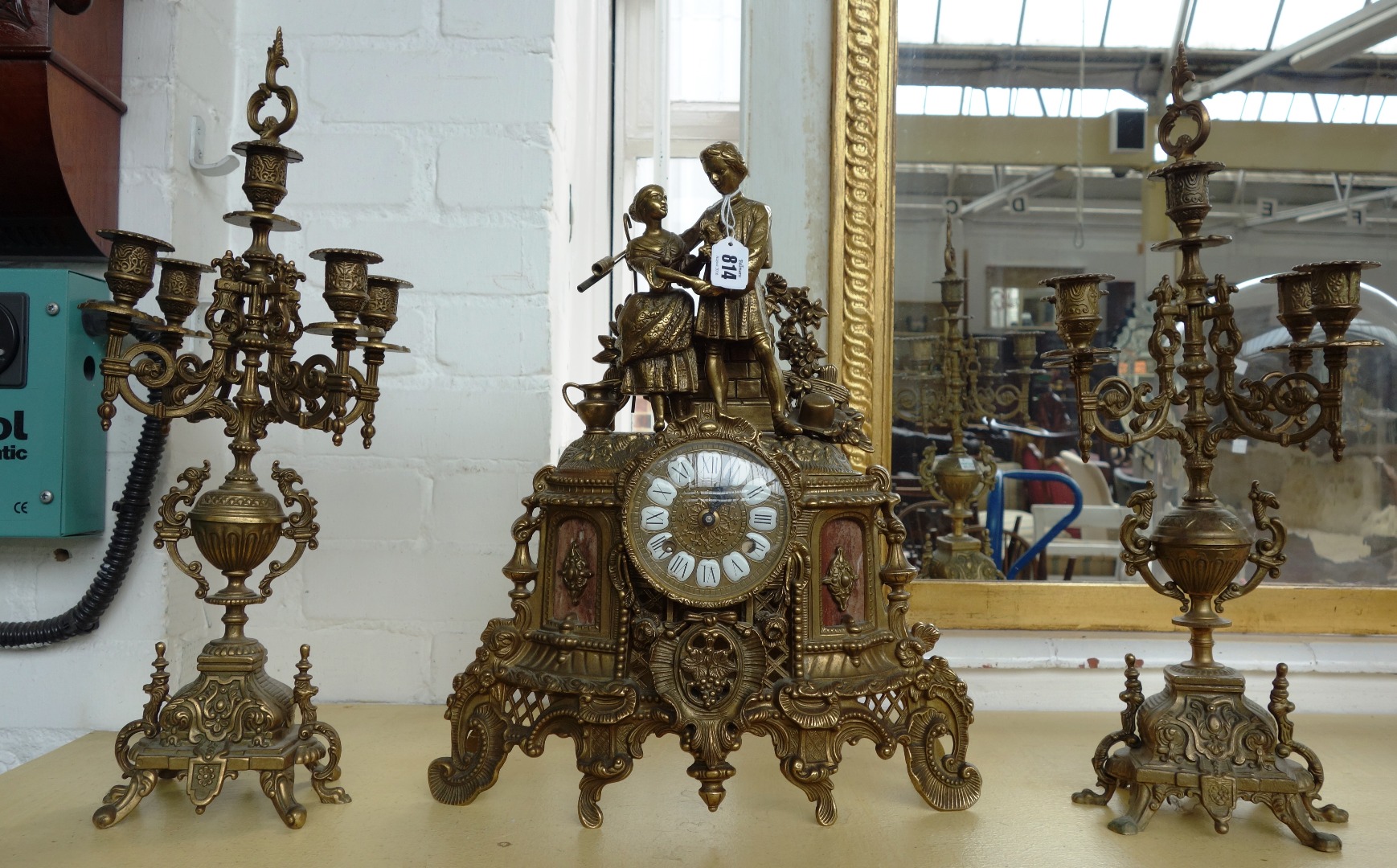 Appraisal: An early th century brass and marble mounted clock garniture