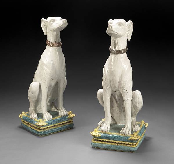 Appraisal: A pair of glazed earthenware models of seated greyhounds Each