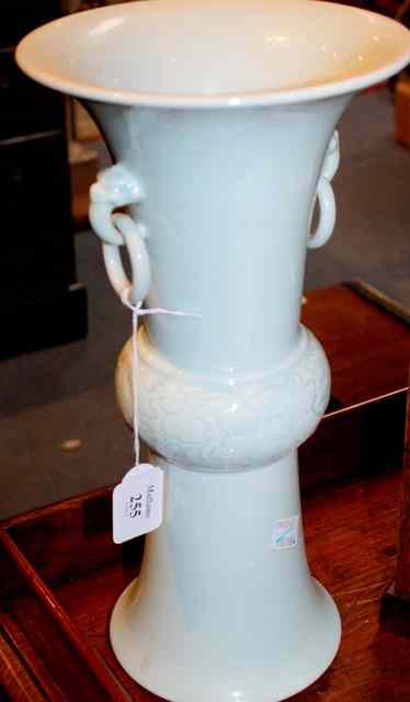 Appraisal: A CHINESE CELADON GLAZED VASE of ribbed and flared cylindrical