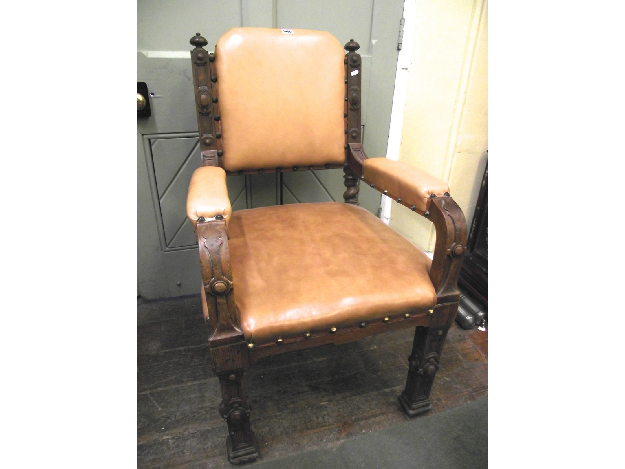 Appraisal: A Victorian gothic oak elbow chair raised on square moulded