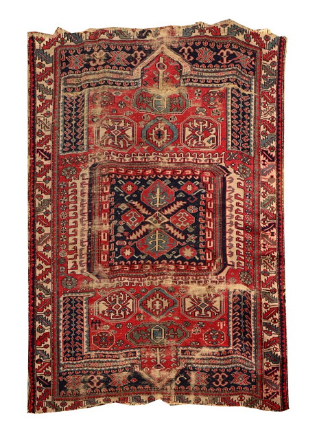 Appraisal: AN OLD PERGAM RUG decorated with stylistic geometric designs on