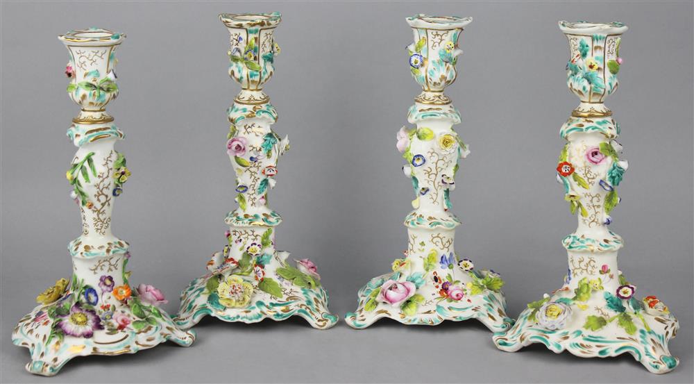 Appraisal: FOUR COALBROOKDALE TYPE FLOWER-ENCRUSTED CANDLESTICKS ca s each with foliate-molded