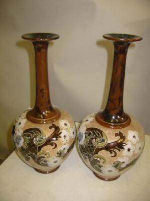 Appraisal: A PAIR OF ROYAL DOULTON POTTERY VASES of bottle form