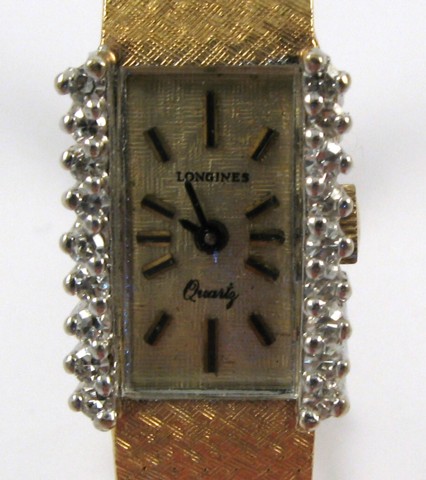 Appraisal: LADY'S DIAMOND AND FOURTEEN KARAT GOLD BRACELET WRISTWATCH Longines quartz